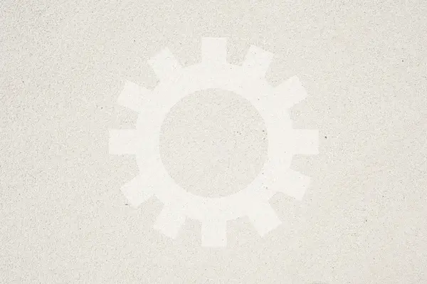 Fogaskerék ikonra a homok háttér és szerkezetű — Stock Fotó