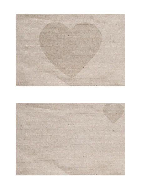 Значок сердца на бумажном фоне и текстуре — стоковое фото