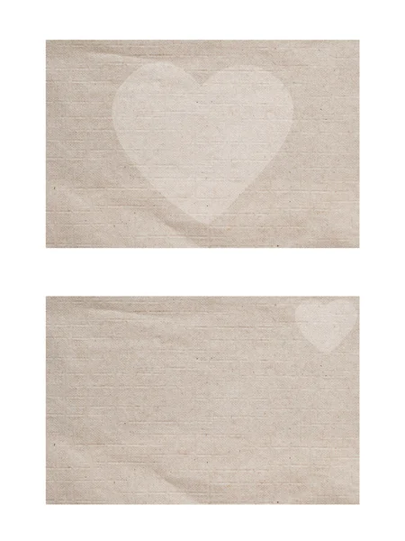 Icono del corazón sobre fondo de papel y textura —  Fotos de Stock