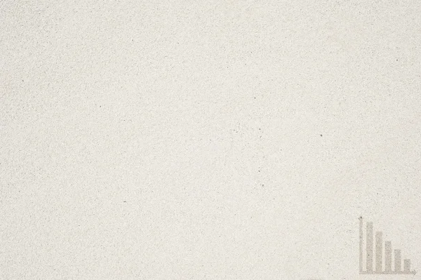 Значок на песчаном фоне и текстуре — стоковое фото