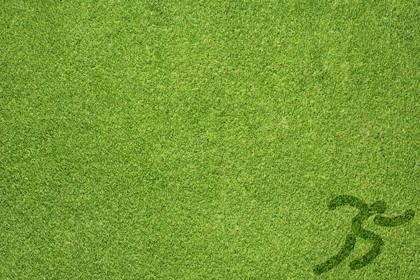 Sport körs på grönt gräs konsistens och bakgrund — Stockfoto