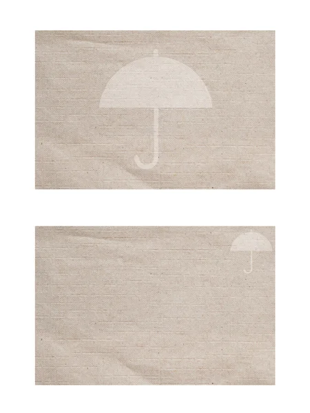 Umbrella icon on paper background and textured — Stock Photo, Image