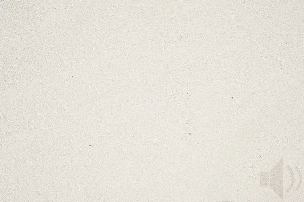 Icona altoparlante su sfondo sabbia e texture — Foto Stock