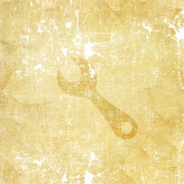 Wrench icon on old paper background — Stock Photo, Image