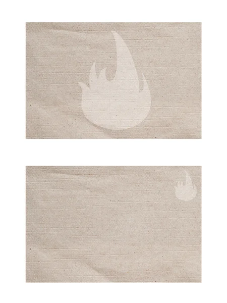 Значок огня на старой бумаге текстуре и фоне — стоковое фото