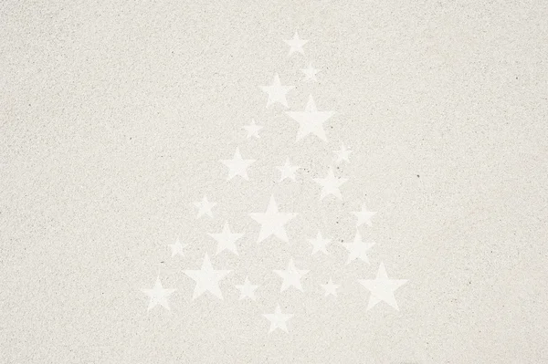 Піктограма ялинки на фоні піску і текстури — стокове фото