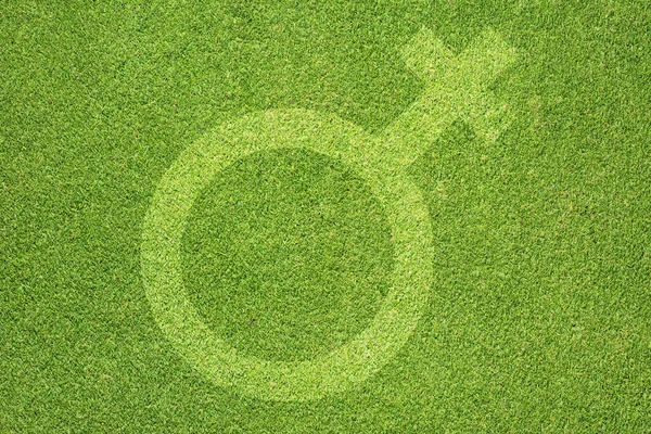 Symbol kobiety płci na trawie — Zdjęcie stockowe