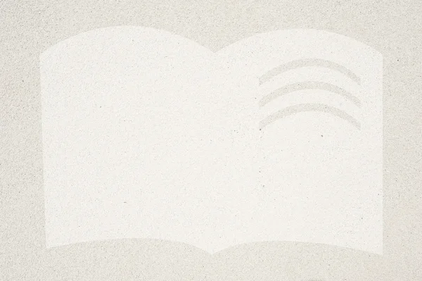 Book icon on sand background and textured — Stock Photo, Image