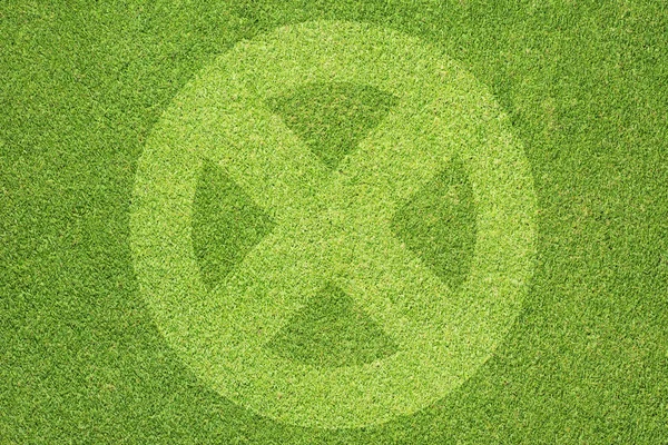 Label icon on green grass background — Stock Photo, Image