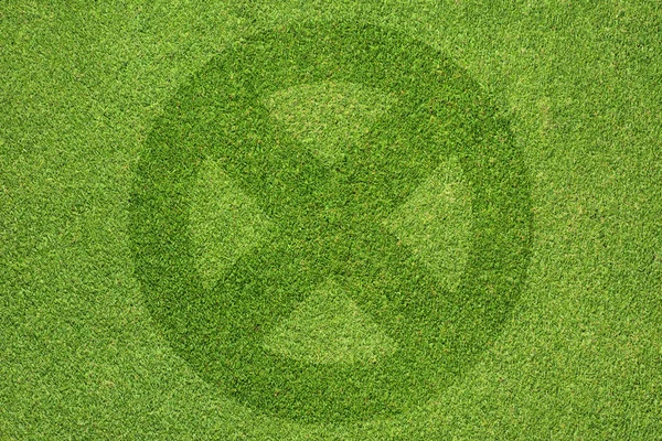 Label icon on green grass background — Stock Photo, Image