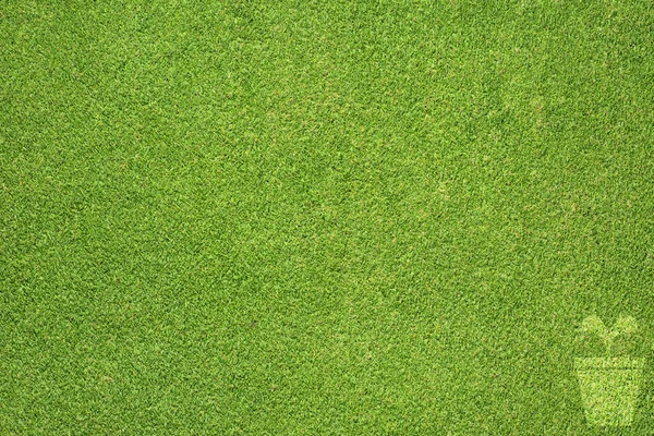 Ícone de panela na textura de grama verde e fundo — Fotografia de Stock