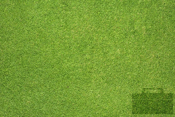 Піктограма сумки на зеленій текстурі трави та фоні — стокове фото
