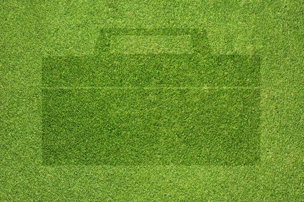 Çanta simgesi yeşil çim doku ve arka plan — Stok fotoğraf