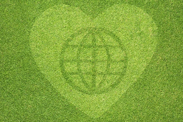 Global with heart icon on green grass — Stock Photo, Image