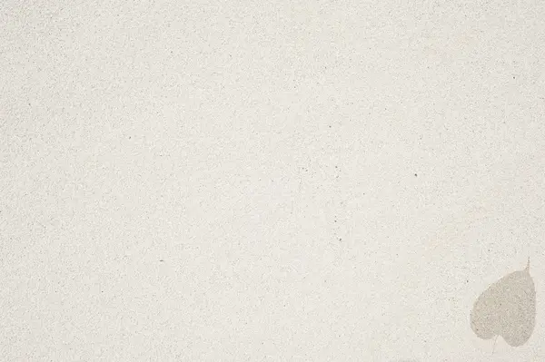 Ícone de folha no fundo de areia e texturizado — Fotografia de Stock