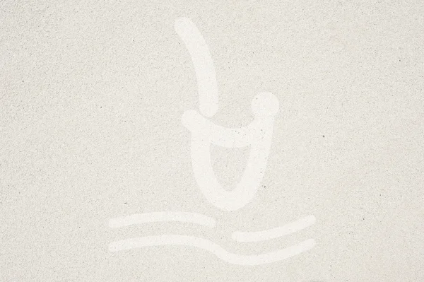 Icône de nage sur fond de sable et texturé — Photo