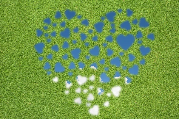 Heart icon with grass and sky — Stock Photo, Image