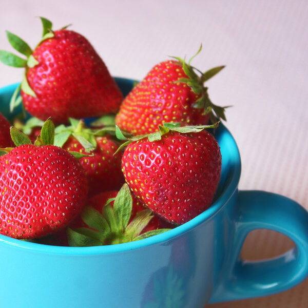 Fresh strawberries in a cup, healthy fruit snack