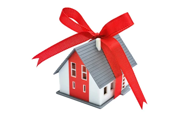 Gift house with red ribbon — Stock Photo, Image