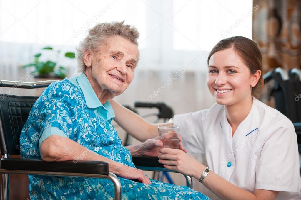 senior woman with home caregiver