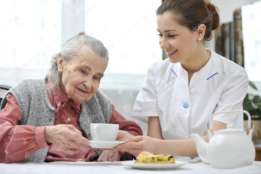 senior woman with home caregiver