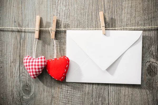Message and red hearts on the clothesline — Stock Photo, Image