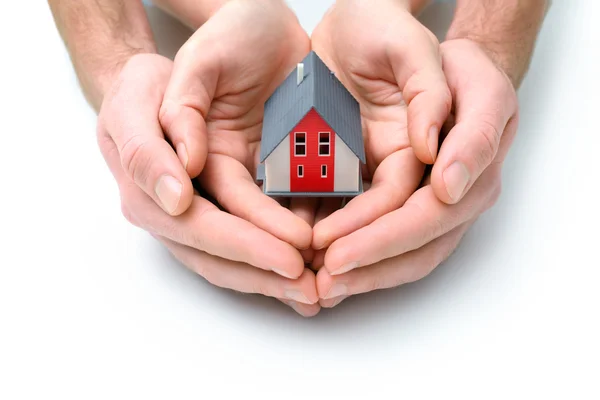 House in human hands — Stock Photo, Image