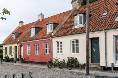 cityscape of traditional picturesque terraced houses with dormers on roofs, shot  in bright cloudy light at Dragor, Denmark