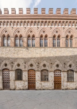 cityscape with medieval palace Gothic facade, shot in bright summer light at Siena, Tuscany,  Italy