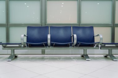 Empty chairs in waiting area clipart