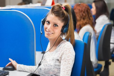girl smiling in call center clipart