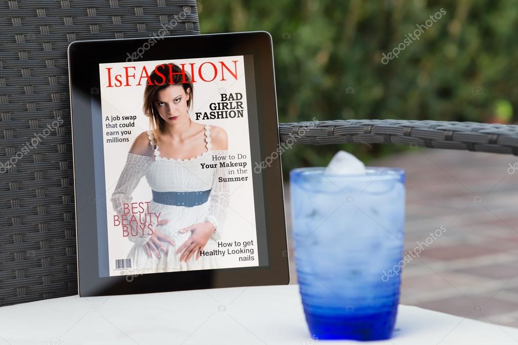 fake fashion magazine cover on a tablet in the garden
