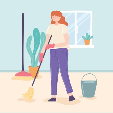 Kadın evde paspas yapıyor.