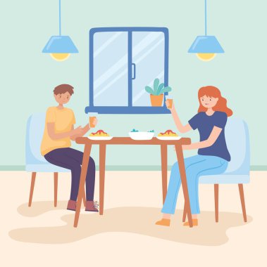 Çift evde yemek yiyor.