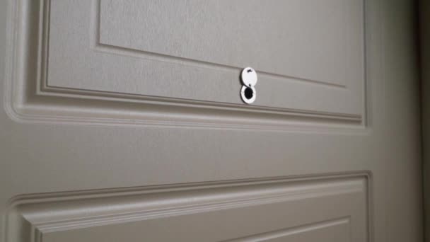 Slow approach to the front door peephole — Stok video