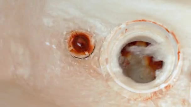 Water flows into the drain hole in the toilet bowl from the tank, inside view. Leaking toilet — Stock videók