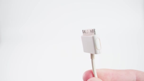 Kyiv, Ukraine - January 16, 2022: 30-pin apple charging connector close-up on a white background — Videoclip de stoc