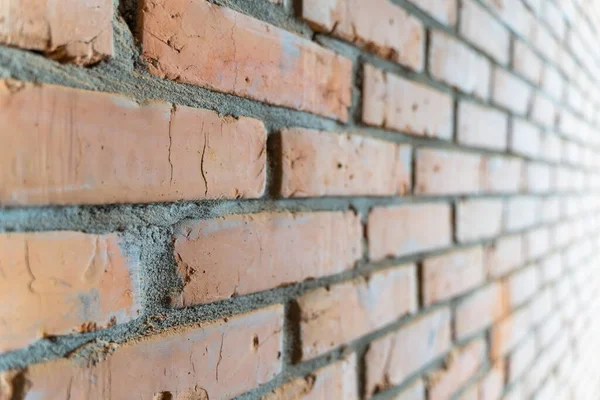 Wallpaper from a brick wall. Full screen red brick wall. Building background in perspective