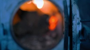 Blurred background and wallpaper from open hearth furnace with burning fire. High quality 4k footage