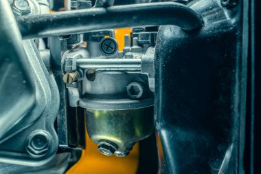 Small carburetor of a gasoline engine of a gasoline electric generator close-up