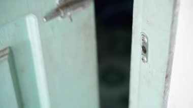 Close up of an old wooden door with a latch. High quality 4k footage