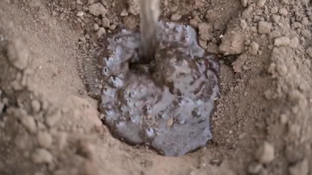 Water Pours Hole Ground Close Filling Depression Top View High — Stok video