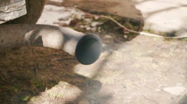 Smoke from the exhaust pipe of an old diesel car close-up. High quality 4k footage