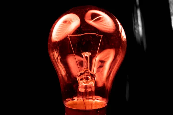 Light Bulb Close Dark Red Highlights — Stockfoto