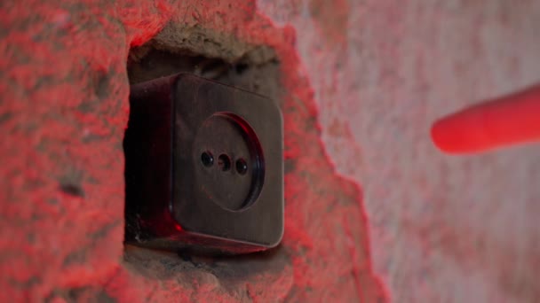 Man Sticks His Finger Socket Red Lighting Close Old Room — Video