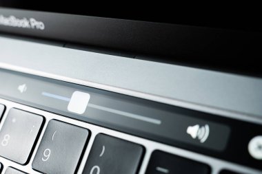 Kiev, Ukraine - August 9, 2022: Volume slider on touch bar apple macbook pro closeup