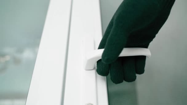 Hand Black Glove Slowly Pulls Handle White Plastic Door Opens — Vídeo de stock
