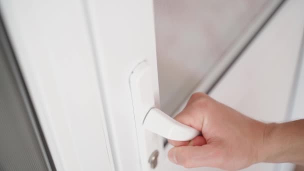 Young Neat Hand Pulls Handle Locked White Plastic Doors Opaque — Vídeo de Stock