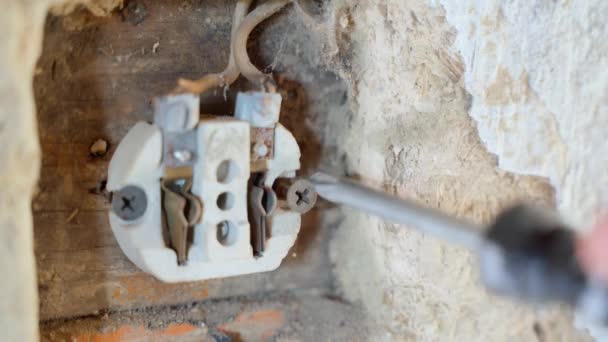 Twisting Ceramic Body Wall Electrical Outlet Close Repair Obsolete Electrics — Vídeo de Stock