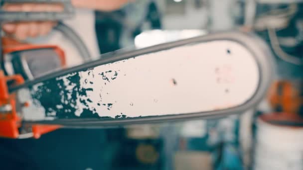 Guy Holds Working Chainsaw Presses Accelerator Close Blurred Background Chainsaw — Stock video